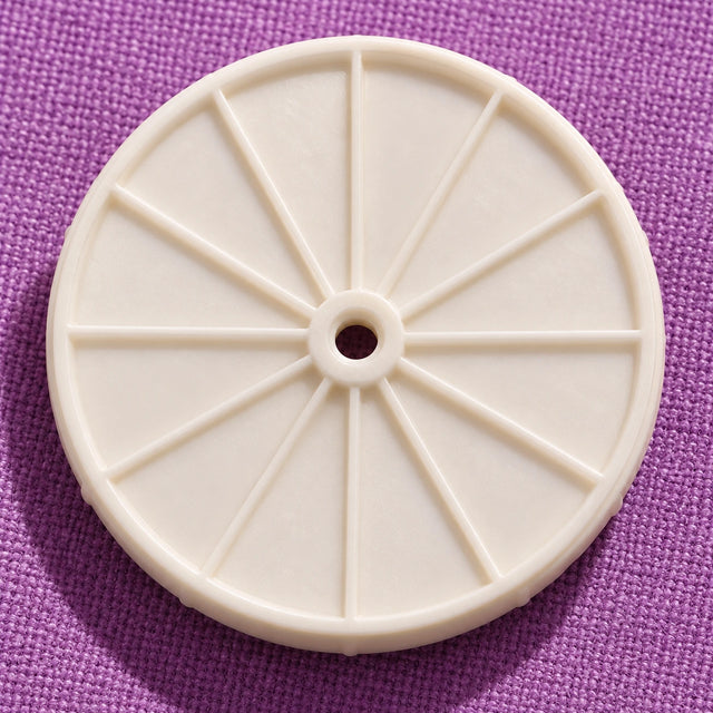 Base fixée au tapis